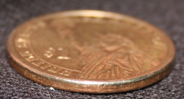 Circulated-Jefferson-Dollar-Missing-Edge-Letters---Fake?