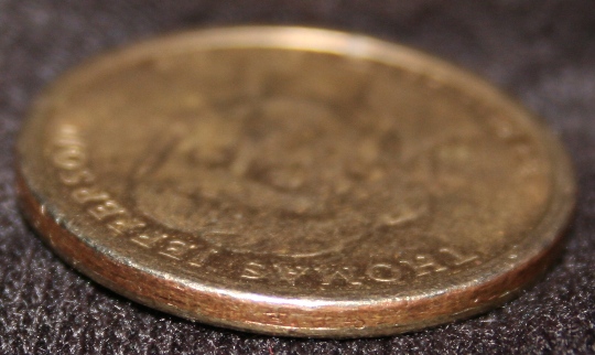 Circulated-Jefferson-Dollar-Missing-Edge-Letters---Fake?
