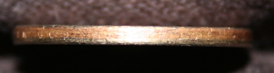 Circulated-Jefferson-Dollar-Missing-Edge-Letters---Fake?