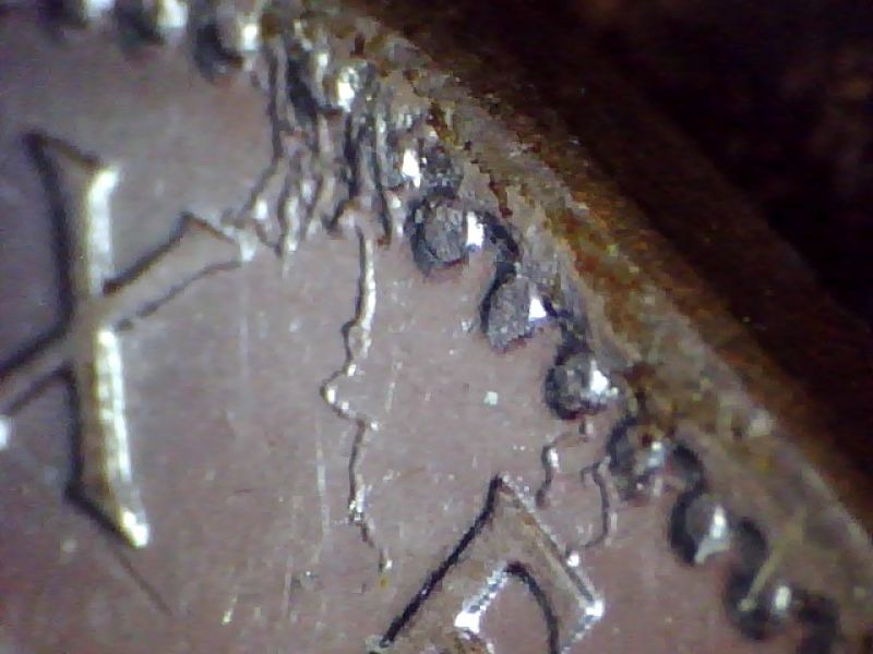 Plating-And-Debris-On-1945-Nickel