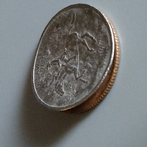Peeling-Clad-Layer-On-Deleware-State-Quarter?