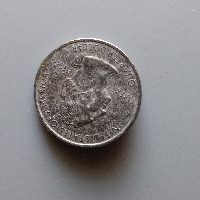 Peeling-Clad-Layer-On-Deleware-State-Quarter?