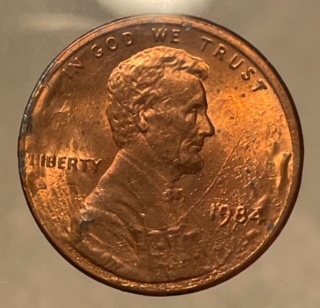 1984-Lincoln-Cent-Struck-Through-Grease?-Or-Is-Reverse-Struck-Through-Cloth?-Appreciate-Any-Help!