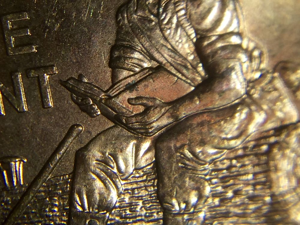 2009-Lincoln-Cent-Split-On-Hand