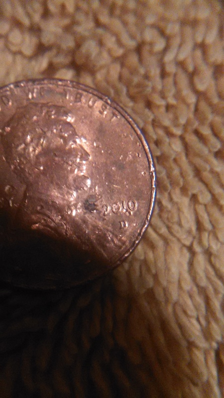 Extra-Number-By-Date-On-This-Chewed-Up-2010-Penny?