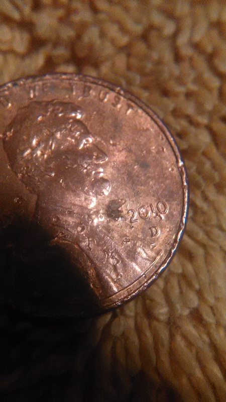 Extra-Number-By-Date-On-This-Chewed-Up-2010-Penny?