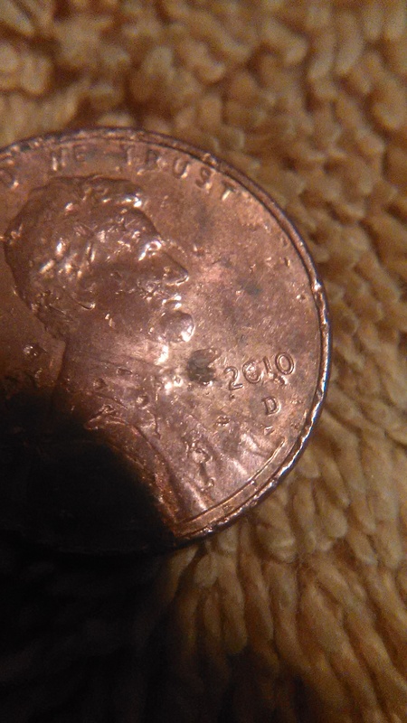 Extra-Number-By-Date-On-This-Chewed-Up-2010-Penny?
