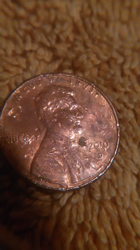Extra-Number-By-Date-On-This-Chewed-Up-2010-Penny?