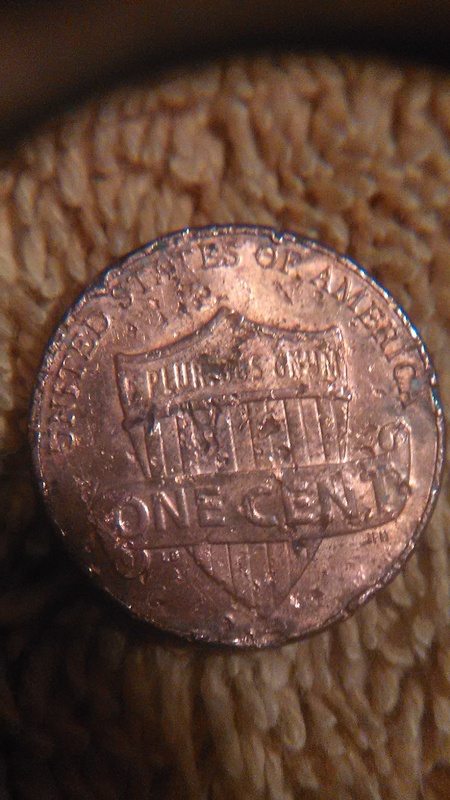 Extra-Number-By-Date-On-This-Chewed-Up-2010-Penny?