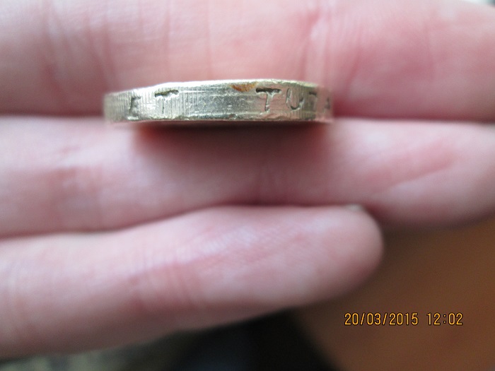 Fake-£1