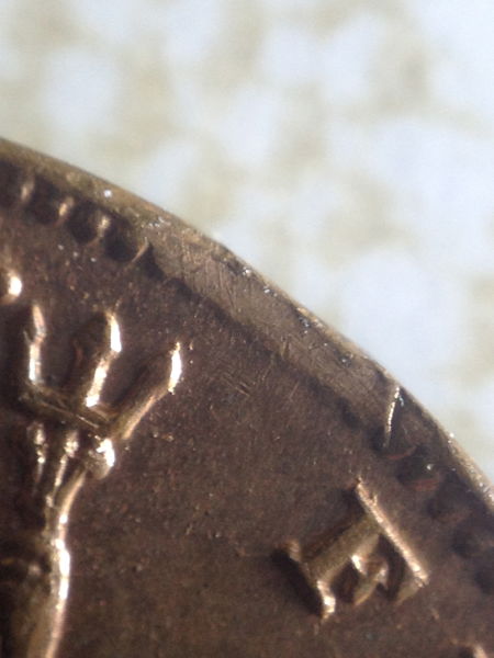Clipped-Planchet-On-British-Farthing