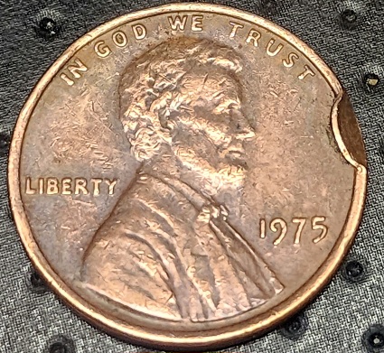 1975-Penny-Try-To-Learn-A-Technical-Name-When-A-Piece-Is-Missing-From-The-Coin