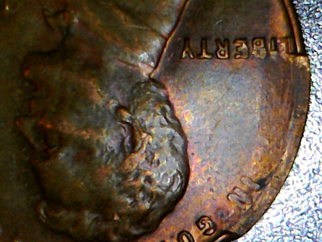 1953-S-Wheat-Penny.-Is-This-PMD-Or-A-Cud-Or-Something-Else?