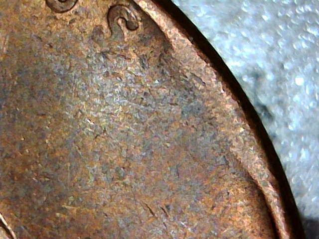 1957-D-Bie,-Plus-Struck-Thru-Debris,-Plus-Lamination,-Plus-Struck-Thru?