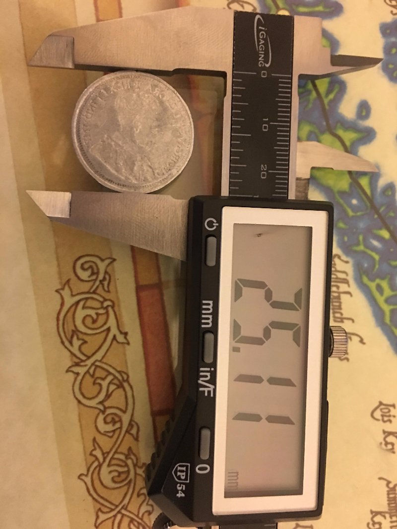 Any-Idea-What-This-Could-Be?-Canadian-25c-Recessed/Reversed-