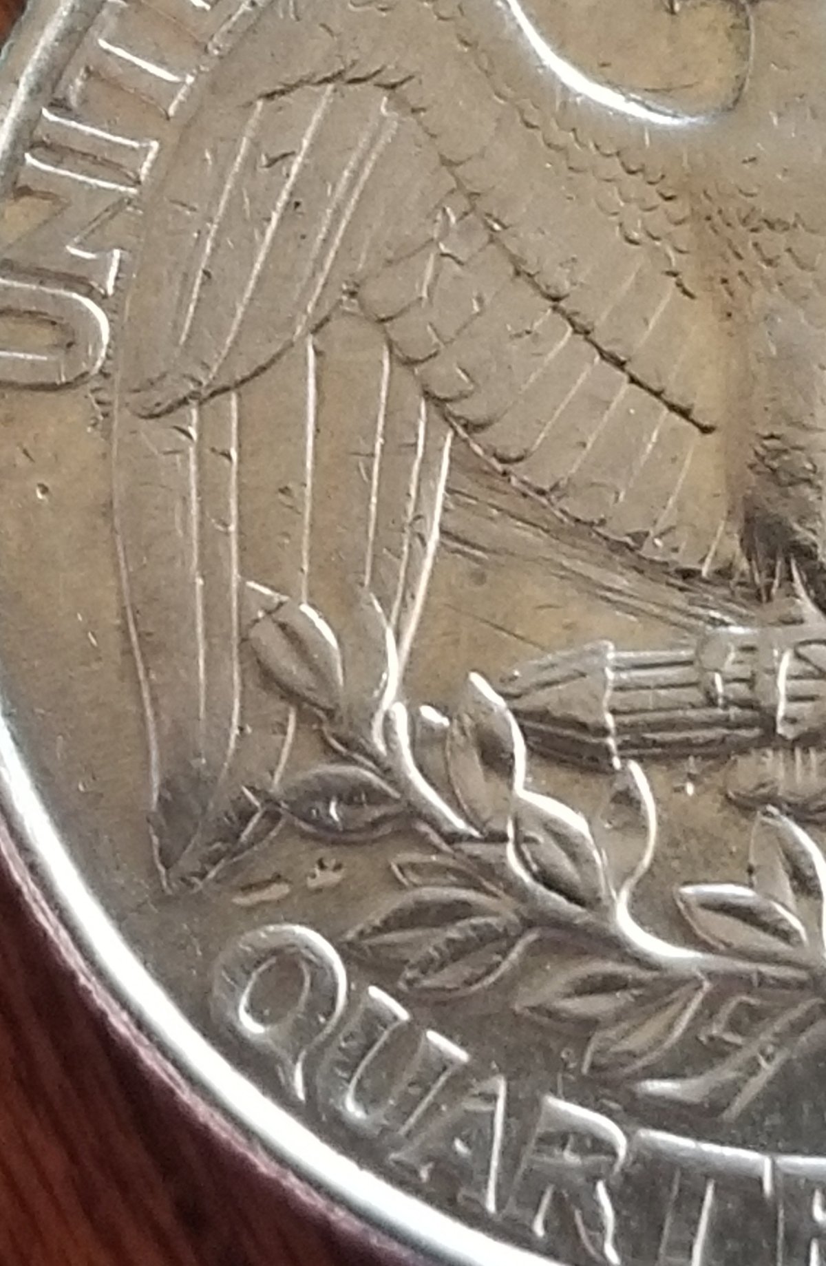 1998-P-Quarter-Reverse-Looks-To-Have-A-Something-Under-The-Eagle