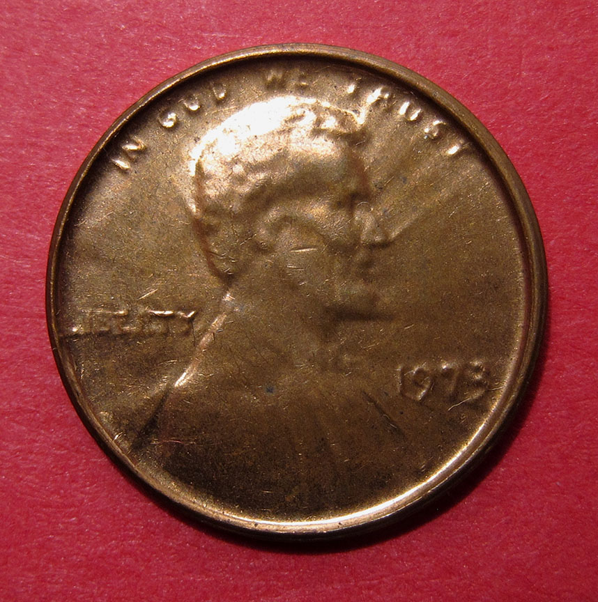 1973-Lincoln-Memorial-Cent-Mint-Error---Struck-Through-Late-Stage-Die-Cap