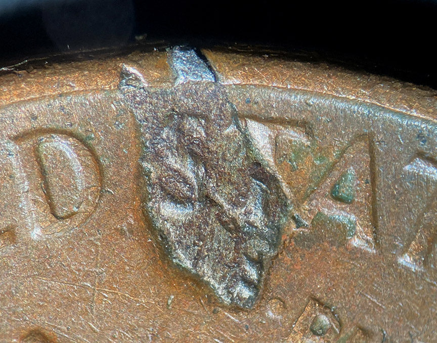 1964-D-Lincoln-Memorial-Cent-Mint-Error---Struck-Through-Metal-Debris