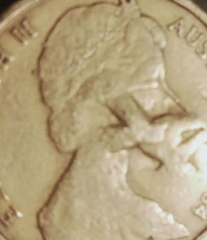 Australian-1-Dollar-Coin-With-Very-Deep-Triangle's-Imprinted-Over-The-Queens-Head