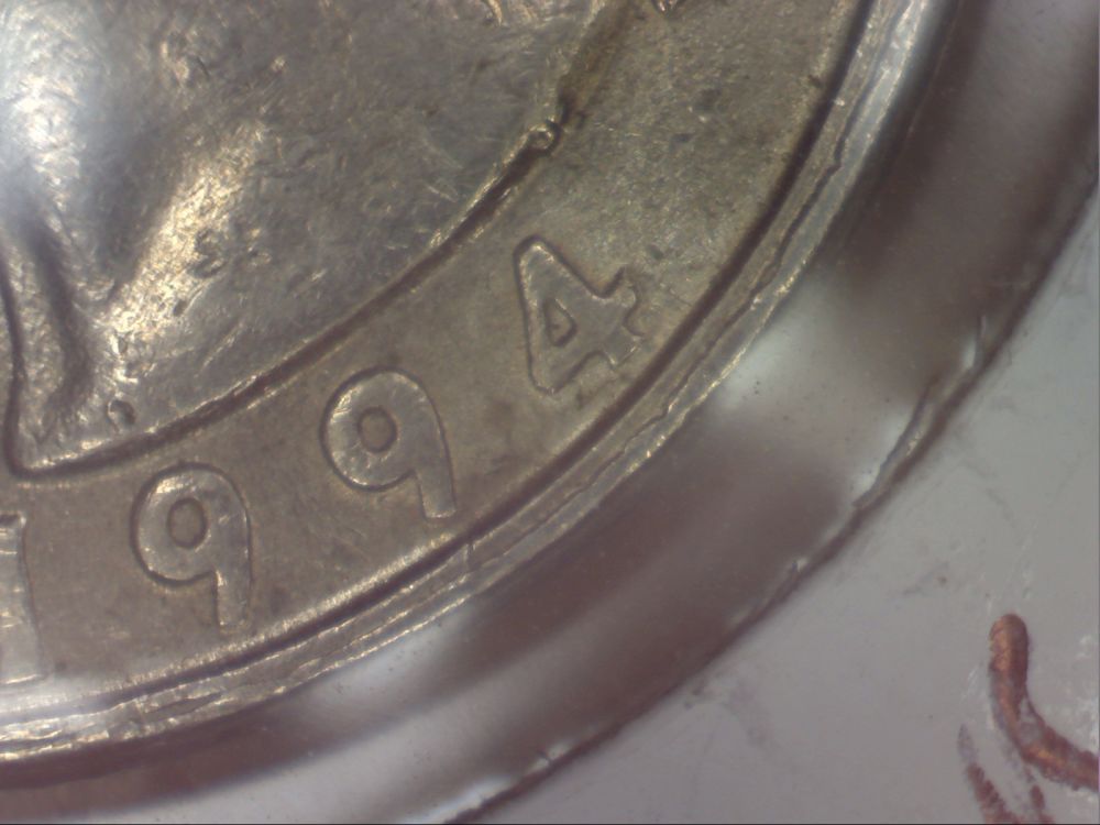 1994-Quarter--Weird-Double-Rim-Thingamajig