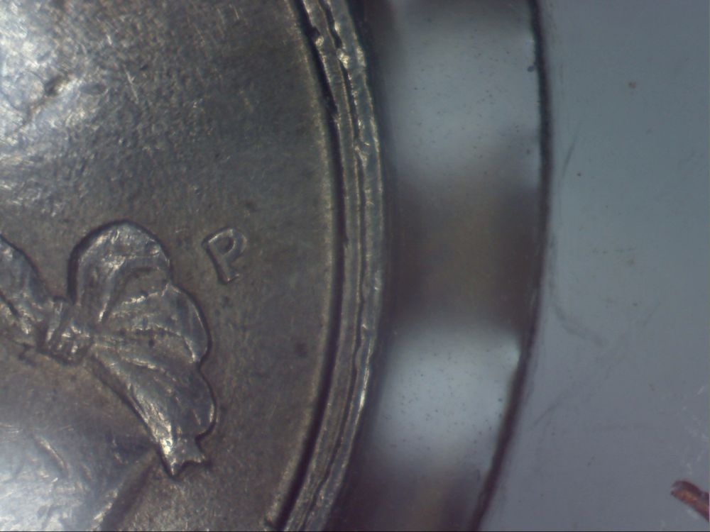 1994-Quarter--Weird-Double-Rim-Thingamajig