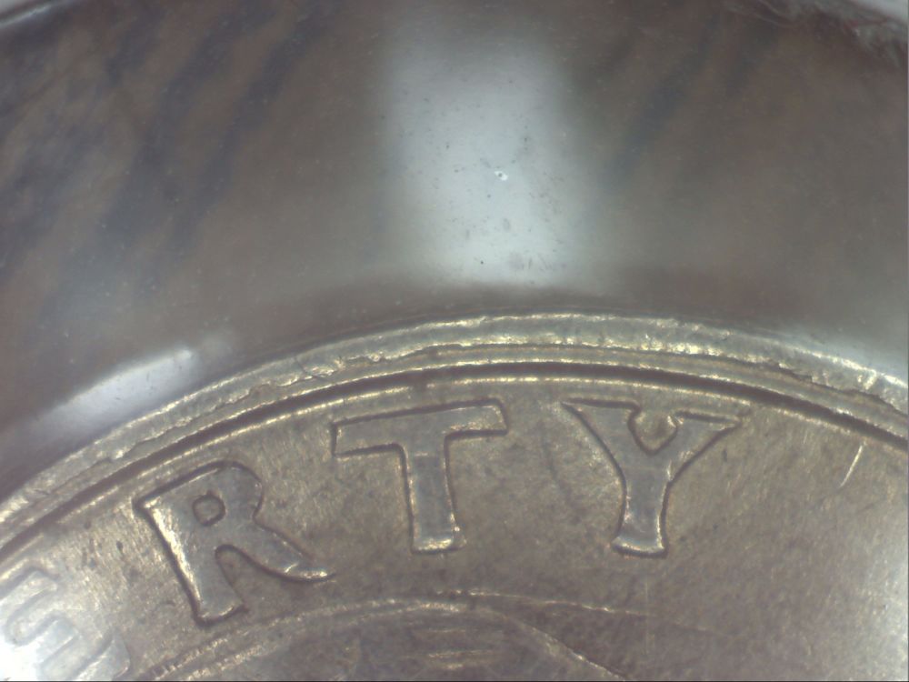 1994-Quarter--Weird-Double-Rim-Thingamajig
