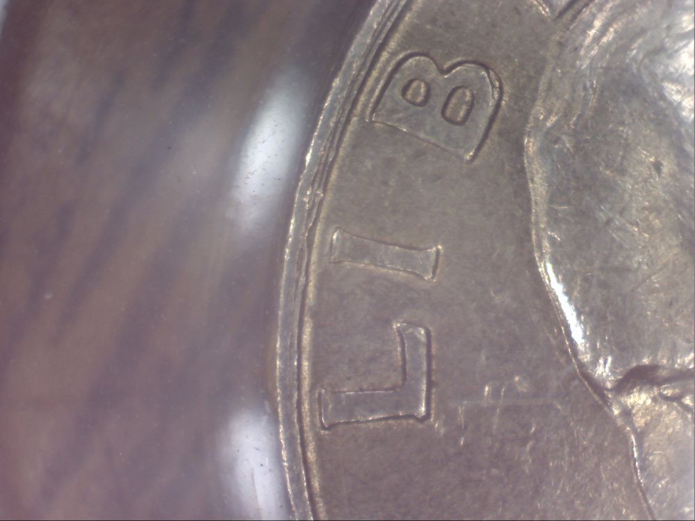 1994-Quarter--Weird-Double-Rim-Thingamajig