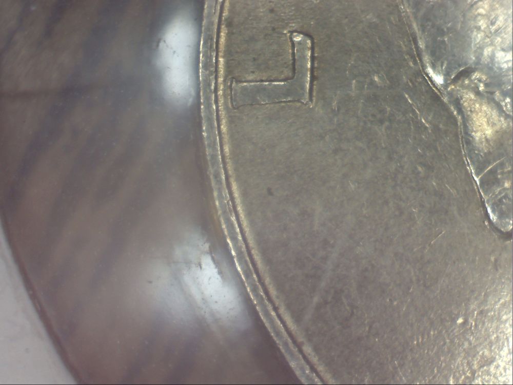 1994-Quarter--Weird-Double-Rim-Thingamajig