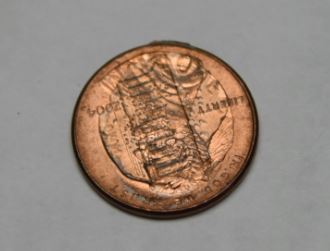 Weird-Error-2004-Penny-Stamped-With-Reverse-Side?