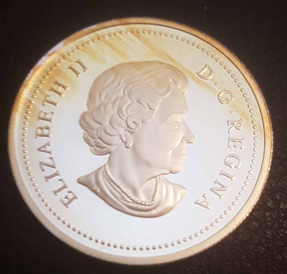 Strange-Toning-Pattern-On-Silver-Dollar
