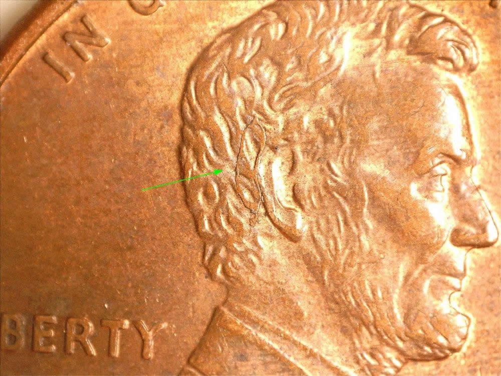 1999-D-Cent-Struck-Through-Or-Lamination?