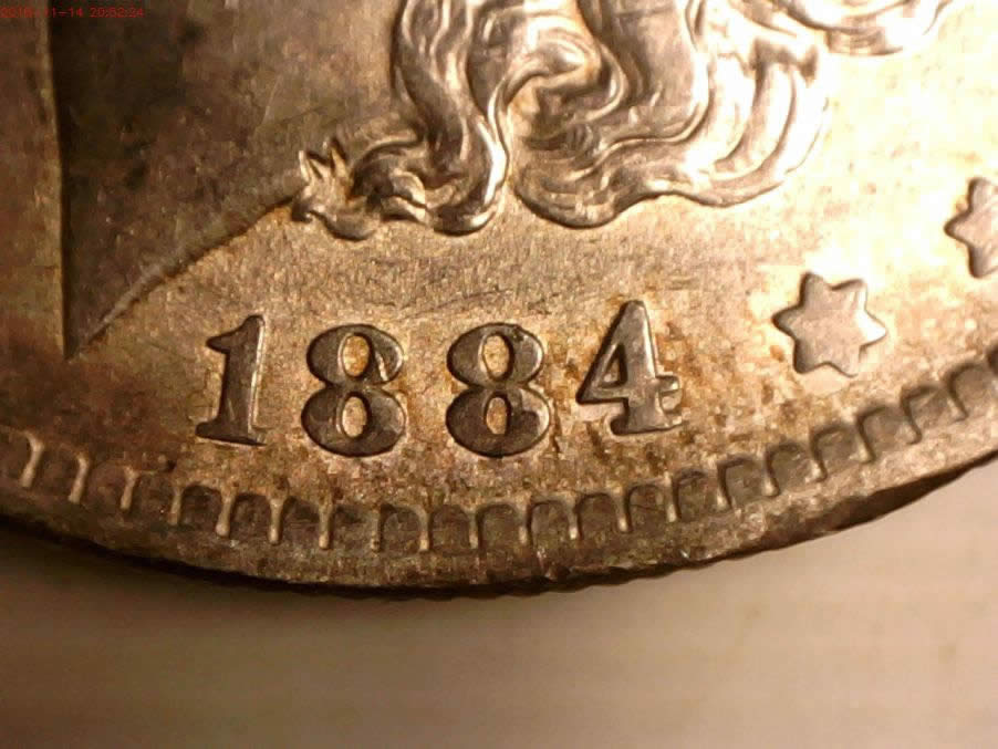 1884-O-Morgan-Line-On-Center-Of-O