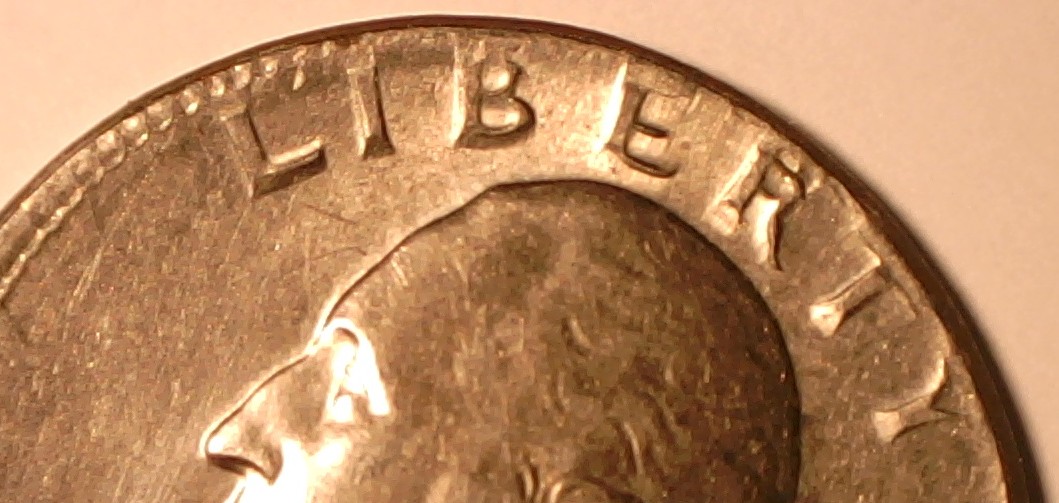 1965-Quarter-With-A-Tilted-Partial-Collar-And-Extrusion-Strike-On-Reverse-?