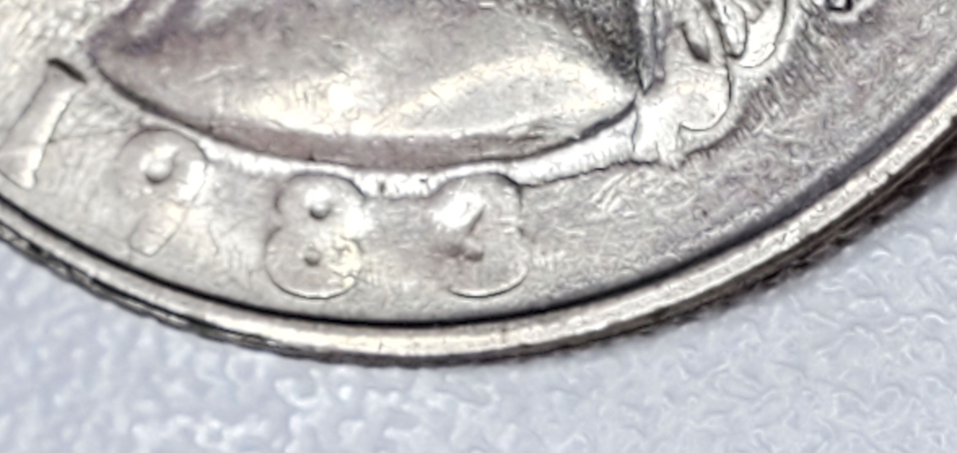 1983-P-Quarter-Strike-Through-Or-Dryer-Coin-Or-Worn-Die?