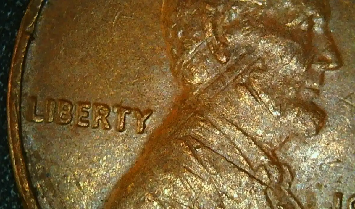 1976-P-LMC-Indent-Obverse-Error-Lincoln's-Face-Has-Part-Of-The-Memorial-From-The-Reverse.