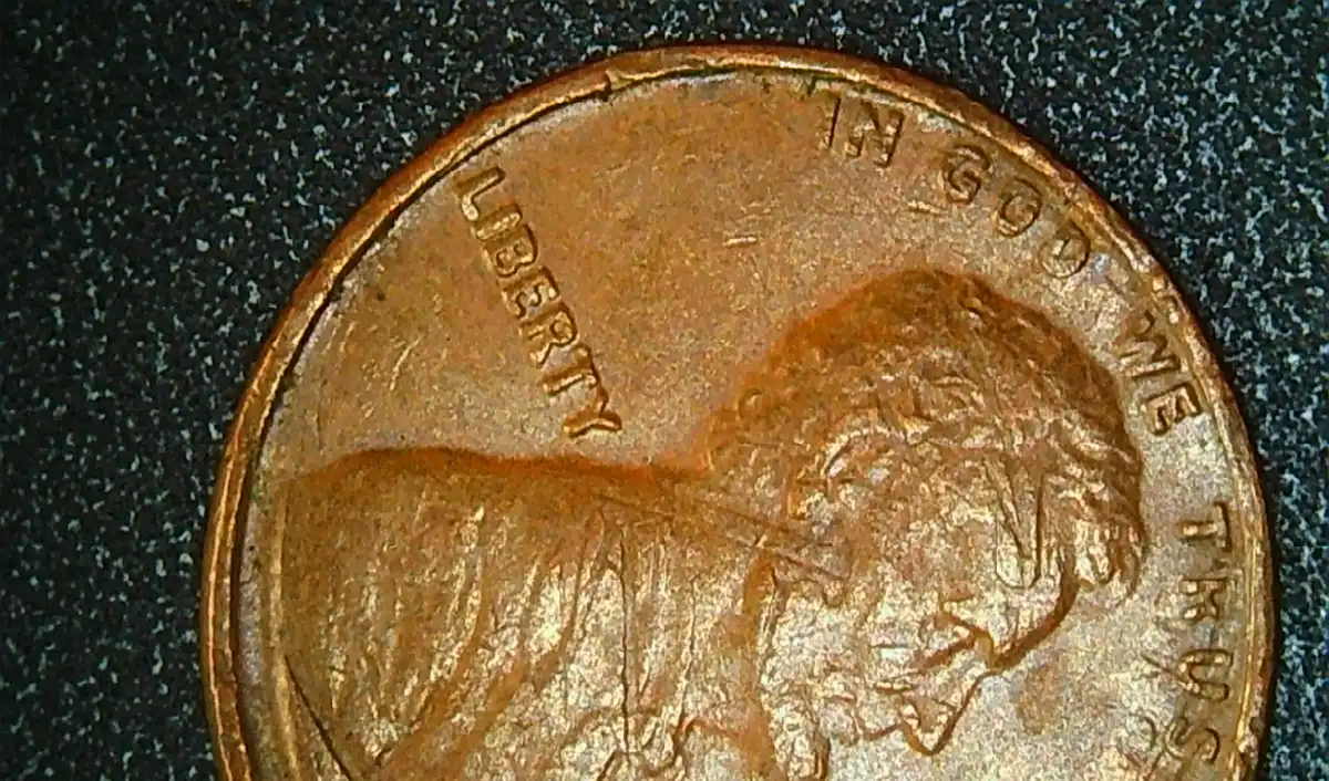 1976-P-LMC-Indent-Obverse-Error-Lincoln's-Face-Has-Part-Of-The-Memorial-From-The-Reverse.