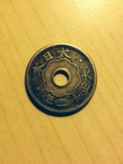 Unknown-Origin-Of-Coin-With-Hole-In-Center