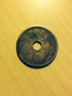 Unknown-Origin-Of-Coin-With-Hole-In-Center