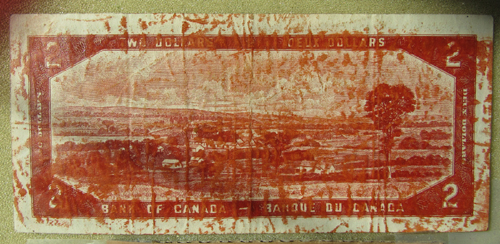 Canadian-1954-$1.00-Bill,-Devils-Face-With-Huge-Ink-Smear-On-Reverse.