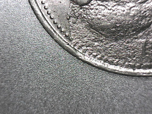 Quarter-Struck-Through-Thin-Cent-Layer