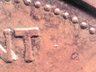 1985-Cent-Struck-On-A.n.-Other-Coin